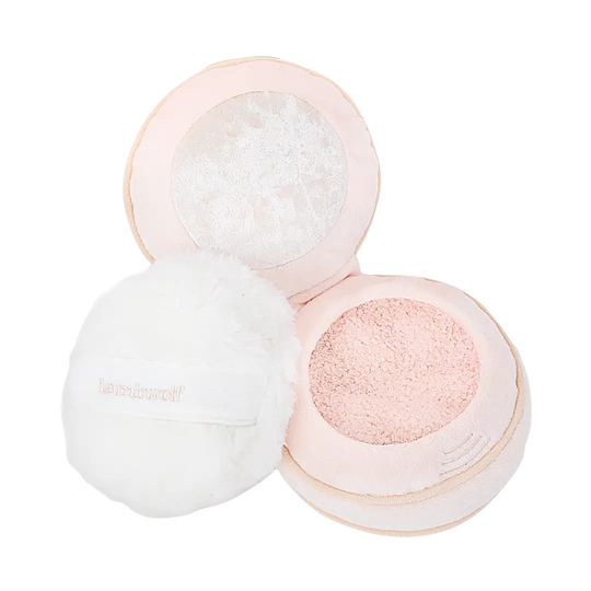 A plush makeup cushion set with a pale pink cushion, a white fluffy puff, and a matching pink plush case, shown on a clean white background.