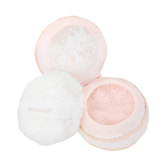 A plush makeup cushion set with a pale pink cushion, a white fluffy puff, and a matching pink plush case, shown on a clean white background.